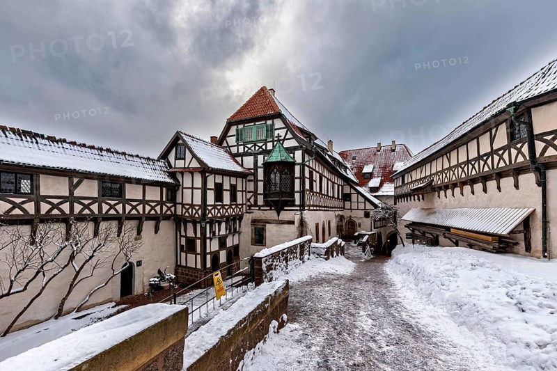 Snowy courtyard of a half-timbered castle with wintry sky, The Wartburg near Eisenach in Thuringia
