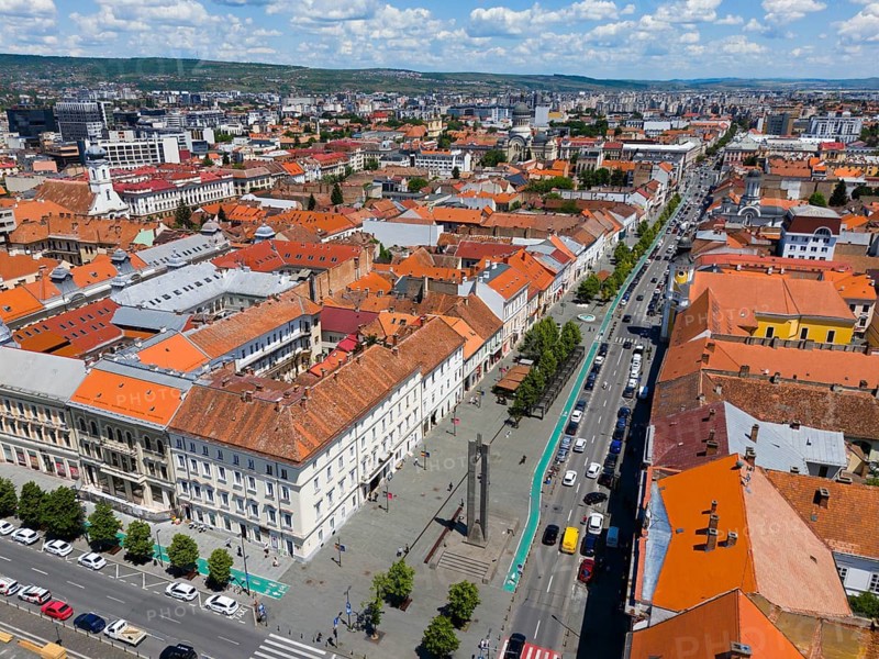 City view with red roofs along a main road under a blue sky, aerial view, view of the Bulevardul Eroilor, Heroes' Boulevard, Cluj-Napoca, Cluj, Transylvania, Transylvania Region, Romania