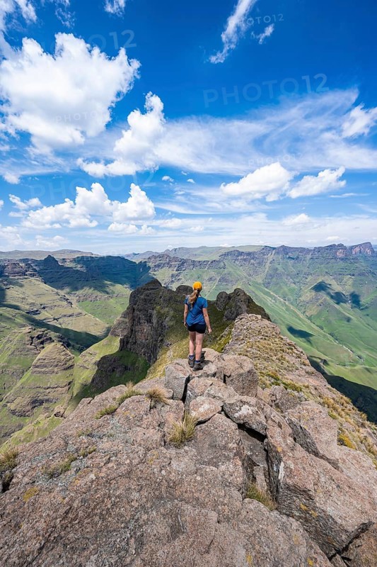 Female mountaineer at the summit of Cathedral Peak or Cathedralpiek or Mponjwana, Drakensberg, KwaZulu-Natal, South Africa