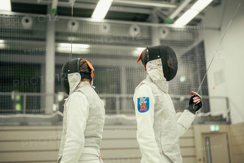 Two fencers are standing back to back in a sports hall and are ready for the next assignment, fencing, TSV Calw, Calw district, Germany