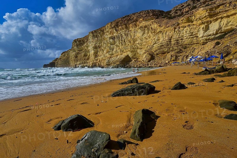 Red Beach, dream beach in the neighboring bay of Matala, large rocks on a quiet beach under a blue sky with only a few people, Matala, south coast, Crete, Greek Islands, Greece