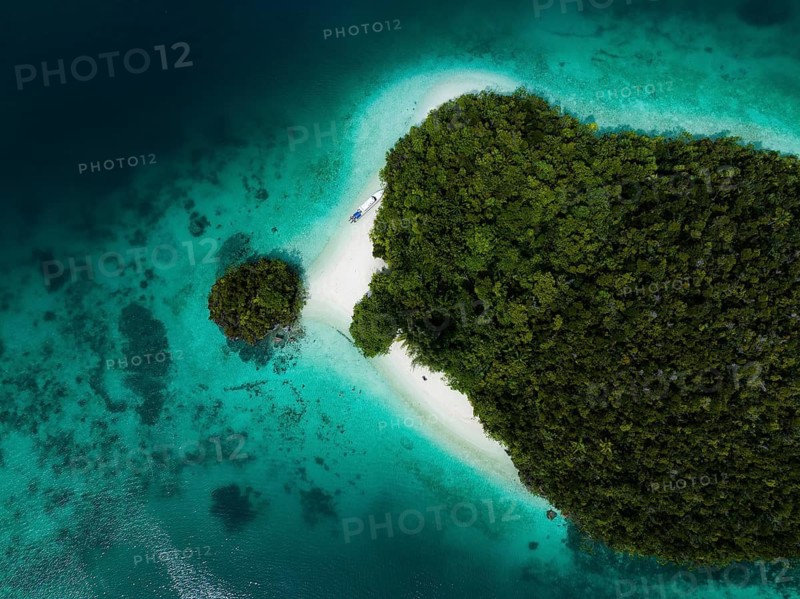 Aerial view of tropical island with turquoise lagoon, Wayag Archipelagio, West Papua, Indonesia