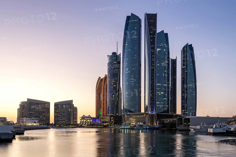 Abu Dhabi Skyline Etihad Towers skyscrapers at night in Abu Dhabi, United Arab Emirates