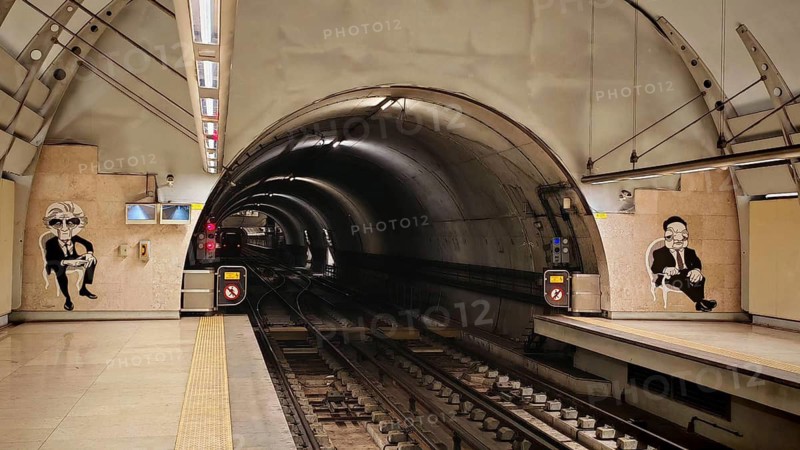 Empty subway tunnel in Lisbon with graffiti on walls and clear tracks, Lisbon, Portugal