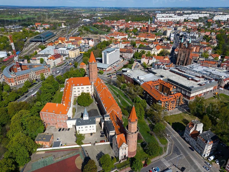 Aerial view of a castle complex with distinctive towers surrounded by cities and green areas, aerial view, Piast Castle, Legnica, Liegnitz, Lower Silesian Voivodeship, Poland