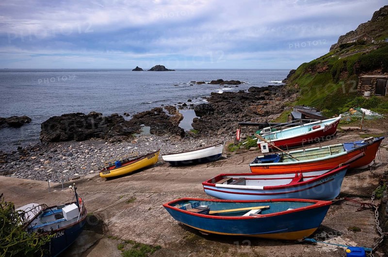 Colourful fishing boats on the sea, Cape Cape Cornwall, behind rock formation, island, The Brisons, St Just in Penwith, Cornwall, England, Great Britain, Great Britain