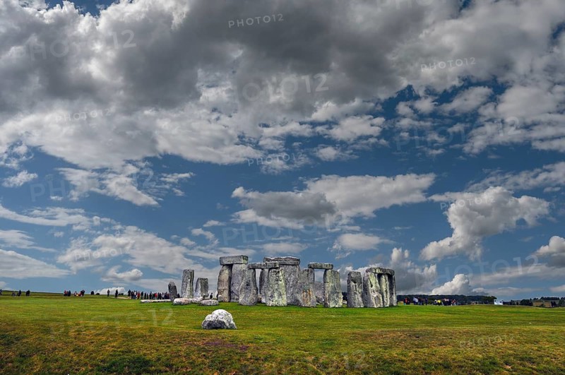 Tourists visit Stonehenge, around 3000 BC, a megalithic structure of the Neolithic period, cloudy skies, Wiltshire, southwest England, England, United Kingdom