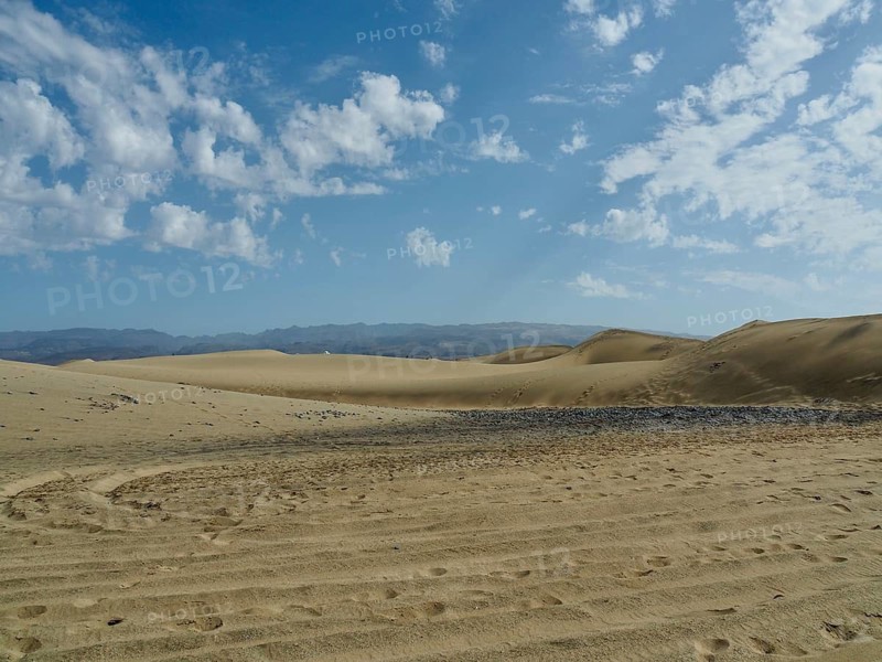 Extensive sand dune landscape with partly cloudy sky, dunes of Maspalomas, Gran Canaria, Spain