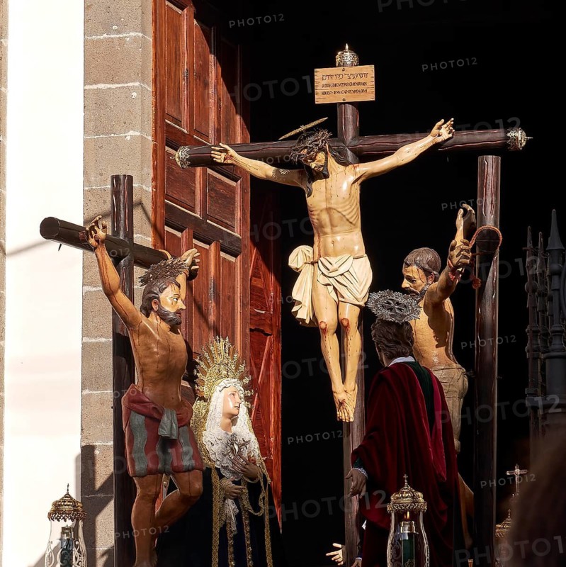 Religious figures on crosses in a church door with sunlight, Good Friday procession, Easter, UNESCO World Heritage Site, old town of San Cristobal de La Laguna, La Laguna, Tenerife, Canary Islands, Spain