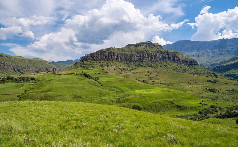 Mountain landscape of the Cathedral Range, view from Cathedral Peak or Cathedralpiek or Mponjwana, Drakensberg, KwaZulu-Natal, South AfricaMountain landscape of the Cathedral Range mountains and green mountain valley, South Africa
