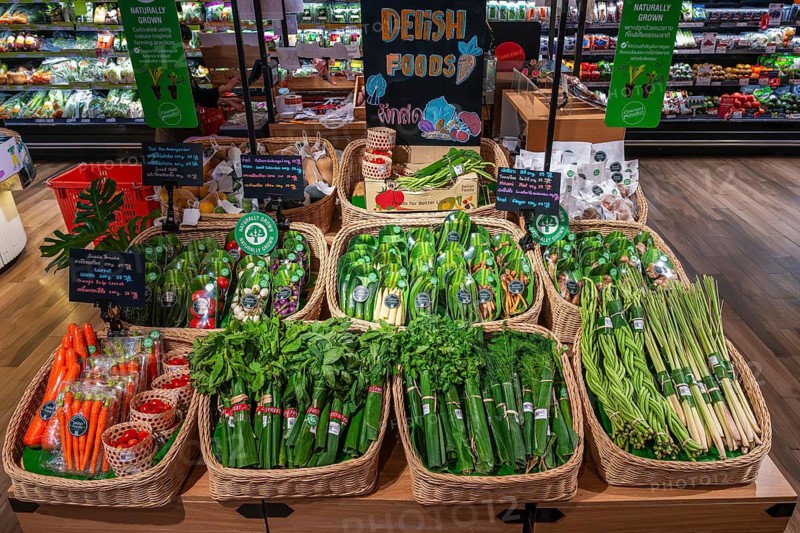 Vegetable and herb sales rack wrapped in banana leaves, Bangkok, Thailand