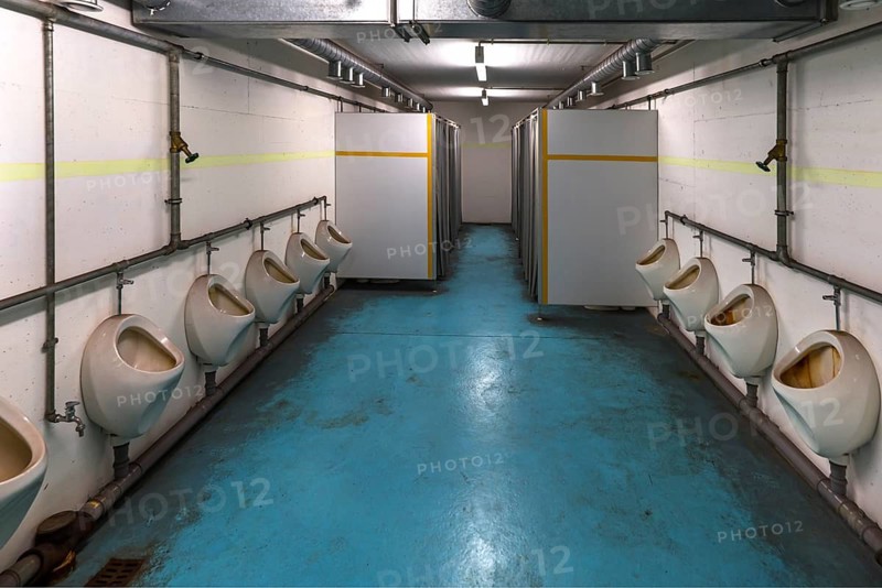 Men's toilet room in the disused nuclear bunker, built for 2, 400 people in the 1970s under Nuremberg Central Station, Nuremberg, Middle Franconia, Bavaria, Germany