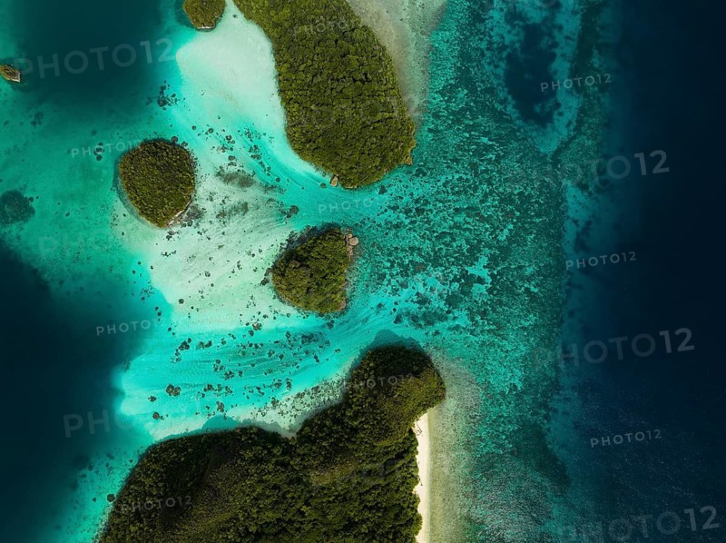 Aerial view of tropical islands and turquoise lagoons from above, Wayag Archipelagio, West Papua, Indonesia