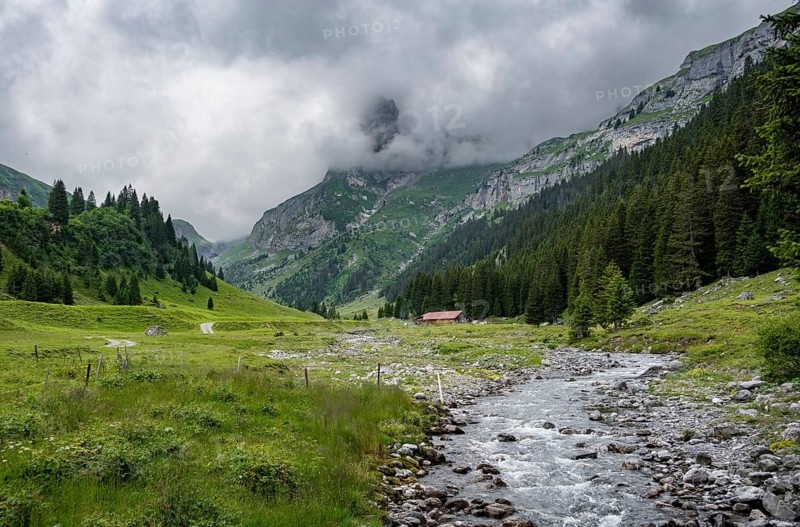 Bach Sousbach in a mountain valley, cloudy mountain landscape, Bernese Alps, Bernese Oberland, Switzerland