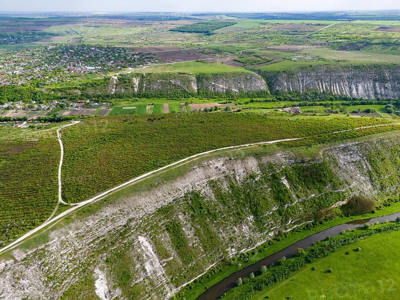 Aerial view of a river snaking through hilly and green fields near a village, aerial view, landscape on the Raut River, Raut, Old Orhei, Orheiul Vechi, archaeological site, protected landscape area, Orhei district, Republic of Moldova, Moldova, Moldova