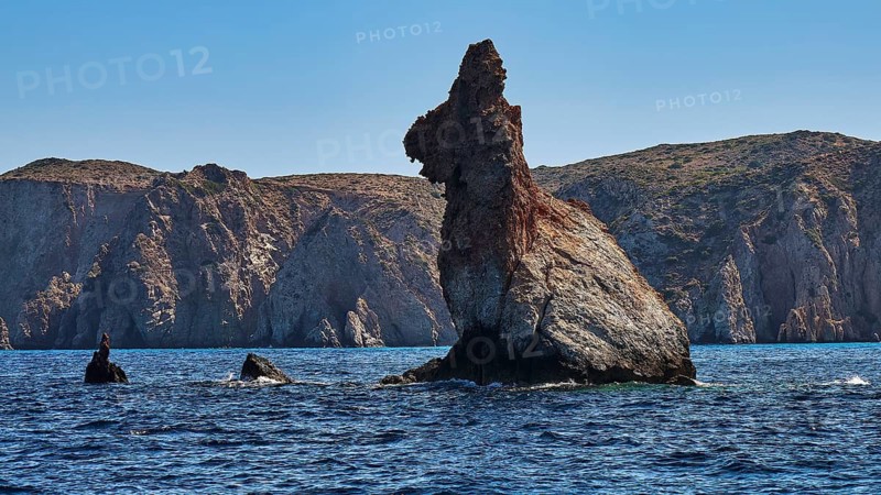 Bear rocks, distinctive rock formation on the coast overlooking the calm, blue sea, Koudes, volcanic island, island, Milos, Cyclades, Greek Islands, Greece