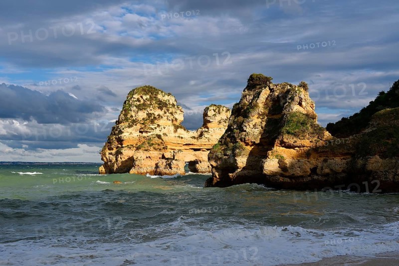 Rock formations on the coast in the evening light, Praia do Camilo, Lagos, Algarve, Portugal
