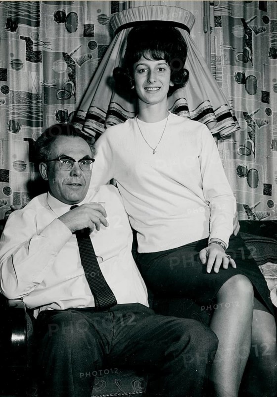 A couple are sitting in a living room featuring 1960s fashion and interior design, Herbert Jacobi (1915–1978), Self-Portrait, 1966