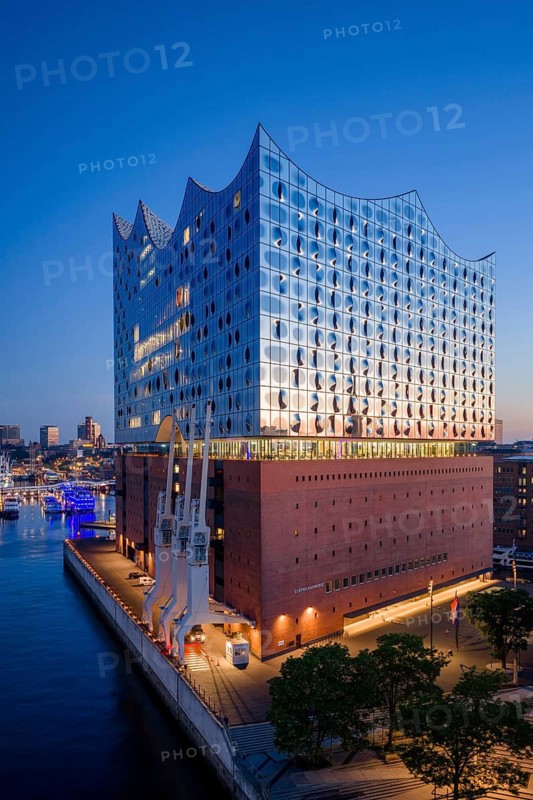 Aerial view of sunrise on the Elbe with Elbe Philharmonic Hall and reflections in the glass façade, Hamburg, Germany