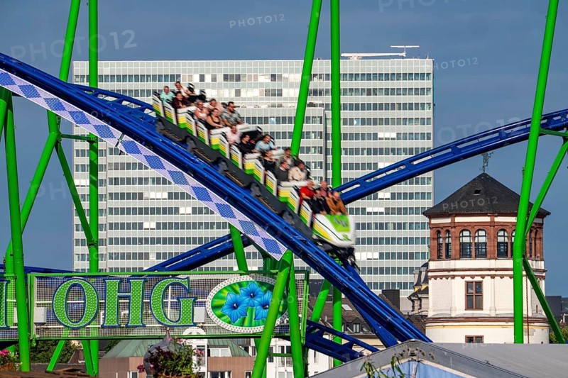 Achterbahn, Alpina Bahn, at the Rheinkirmes in den Rheinwiesen in Düsseldorf-Oberkassel, Dreischeibenhaus, Schlossturm, North Rhine-Westphalia, Germany
