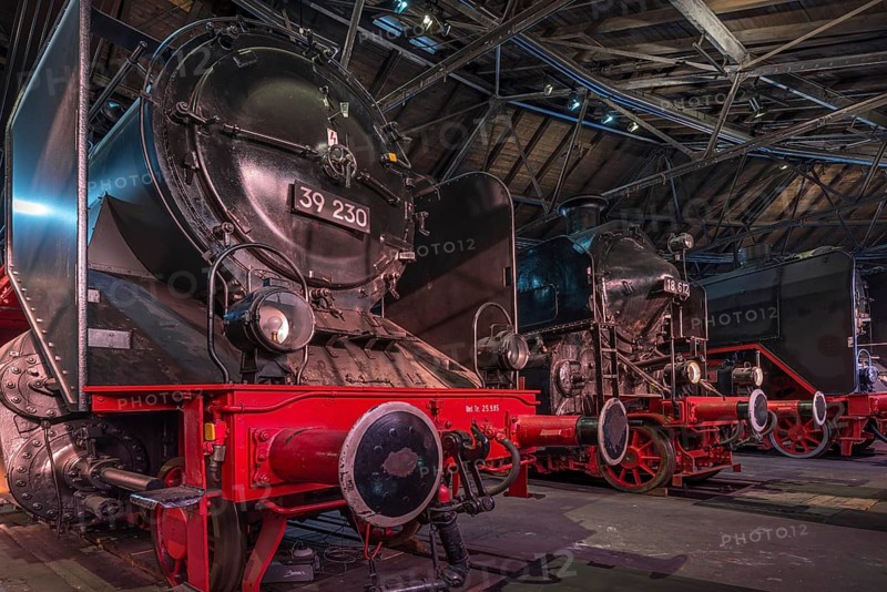 Unit locomotive 39 230 built in 1923 and four-cylinder compound locomotive 18 612 built in 1927 in the Ringlokschuppen, German Steam Locomotive Museum, Neuenmarkt, Upper Franconia, Bavaria, Germany