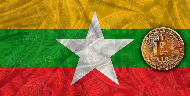 Investors in Blockchain Technology with Myanmar flag background. Bitcoin cryptocurrency with Burmese flag