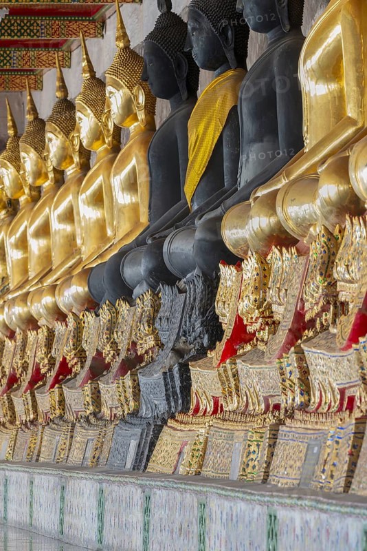 Gilded and black Buddha statues (Bhumispara-mudra: Buddha Gautama at the moment of enlightenment), Wat Suthat Thepwararam, Royal Temple, Phra Nakhon, Bangkok, Thailand