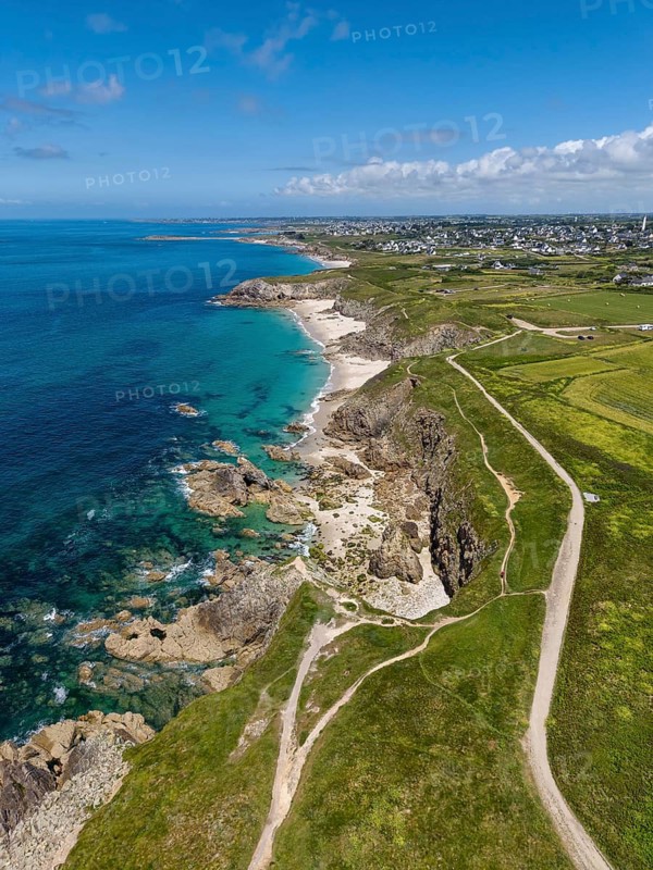 Aerial view of the sandy beach, Plage des Charettes beach north of Pointe Corsen, a cape at the westernmost point of continental France on the Breton coast, on the horizon the village of Kervilon, Commune of Plouarzel, Finistère, Brittany, France