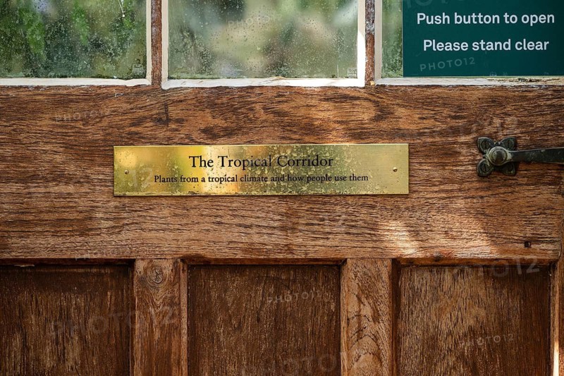 Sign on front door, Tropical Corridor, a hot and humid greenhouse simulating a tropical habitat, Chelsea Physic Garden, historic botanical garden, oldest botanical garden in London, founded in 1673 by the Worshipful Society of Apothecaries, Chelsea, England, Great Britain