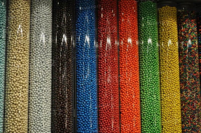 Colorful candy M&M's arranged in vertical tubes, Las Vegas, Nevada, USA