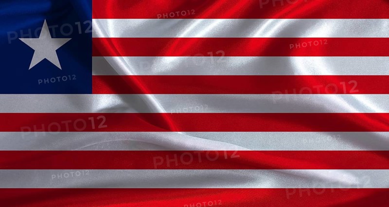 Liberia flag with cloth textured background. National flag of Liberia with realistic texture