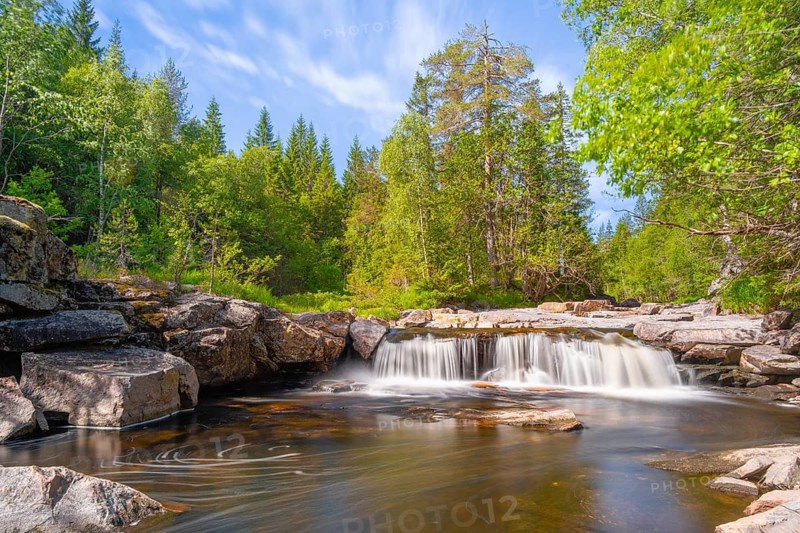 View of a waterfall and the surrounding nature, long exposure, Telemark, Norway