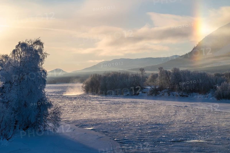 Fog and parhelion over the frozen river Glomma (Glåma), Alvdal, Hedmark, Innlandet, Norway, February 2026