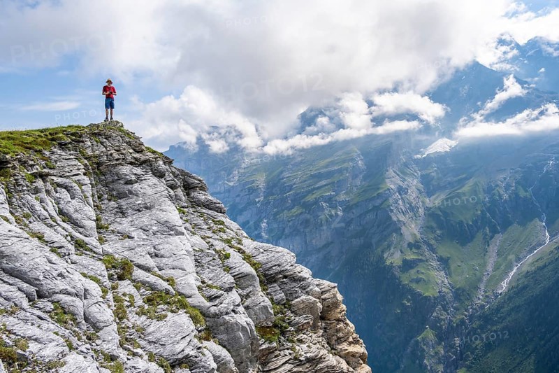 Mountaineers on Tanzbödeli summit in front of mountain landscape, Bernese Alps, Bernese Oberland, Switzerland