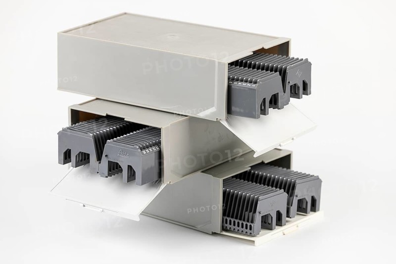 Three gray boxes stacked on top of each other for slides with magazines