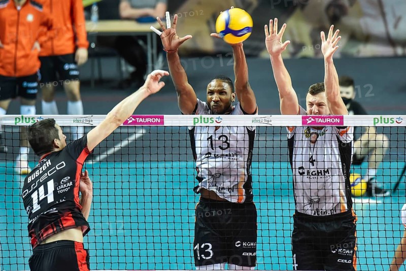 LUBIN, POLAND - DECEMBER 9, 2020: Men's Volleyball Polish PlusLiga match Cuprum Lubin VS Asseco Resovia Rzeszow 3:1. Attaks Rafal Buszek blocksRonald Andres Jimenez Zamora (L) and Dawid Gunia (R)