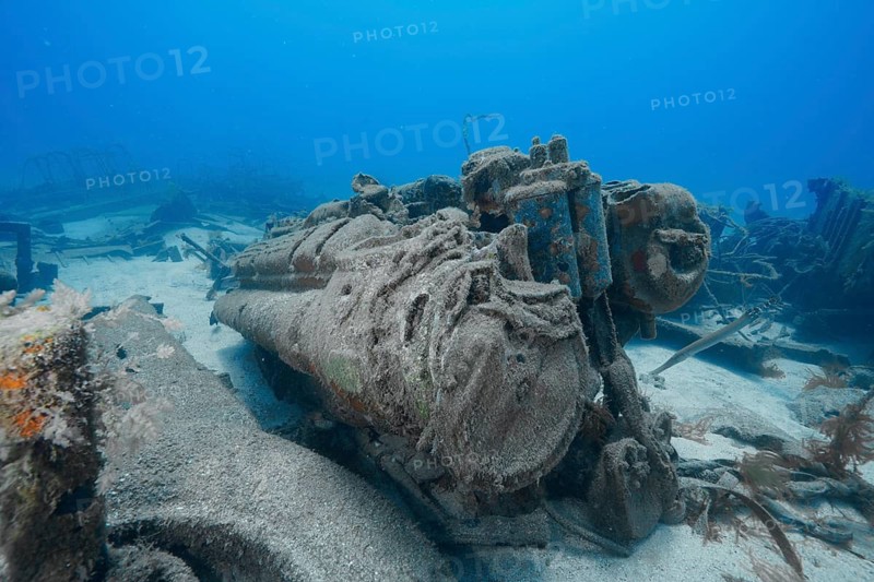 Rusted remains of an engine on the seabed surrounded by sand and wreckage, meteor wreck dive site, Russian hydrofoil, Arguineguin, Gran Canaria, Spain, Europe, Atlantic