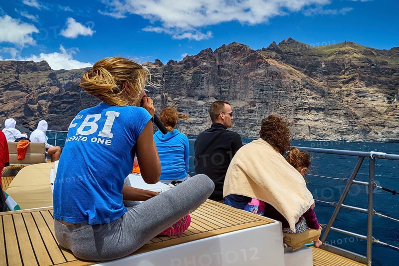 Los Gigantes, group of people sitting on a boat floating off a rocky coast, whale watching boat tour, whale watching, dolphins, west coast, Tenerife, Canary Islands, Spain