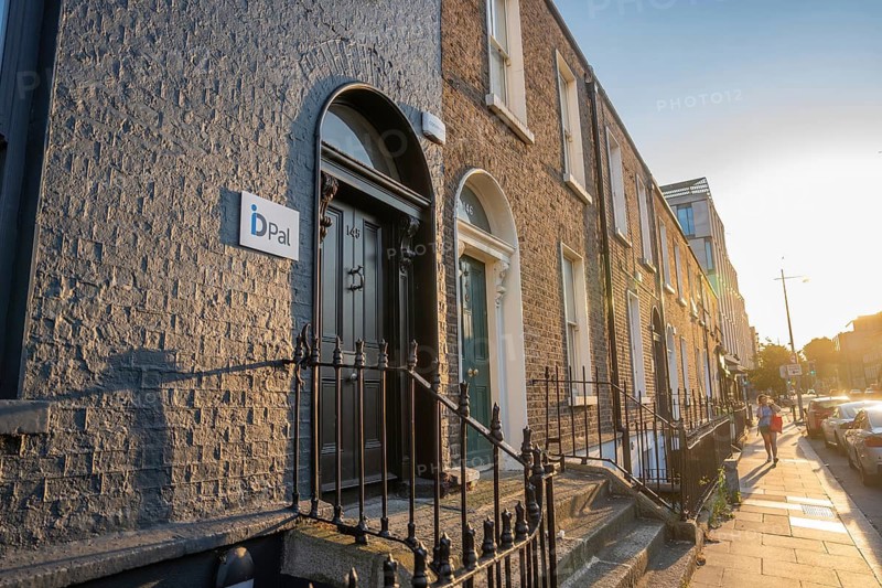 Row of townhouses in warm sunlight with historic architectural elements, Dublin, Ireland