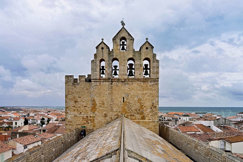 Bell tower of the Notre-Dame-de-la-Mer Roman Catholic Church, Saintes-Maries-de-la-Mer, Camargue, southern France, France