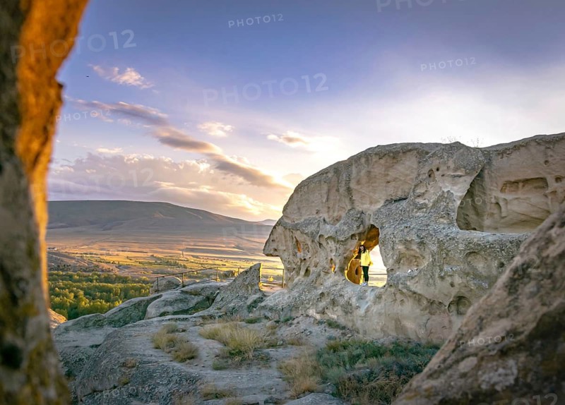 Woman visit famous cave city. Uplistsikhe.Georgia