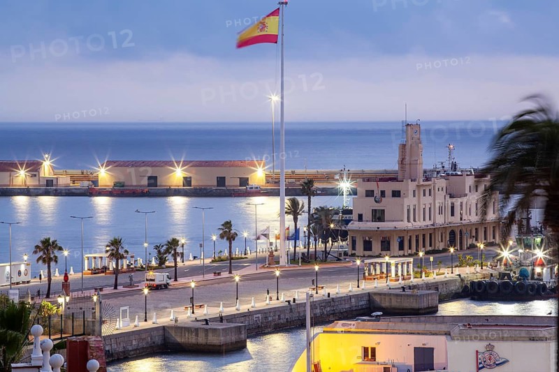 Late afternoon lights illuminate the port Authority building and surroundings, Ceuta, Spain, North Africa