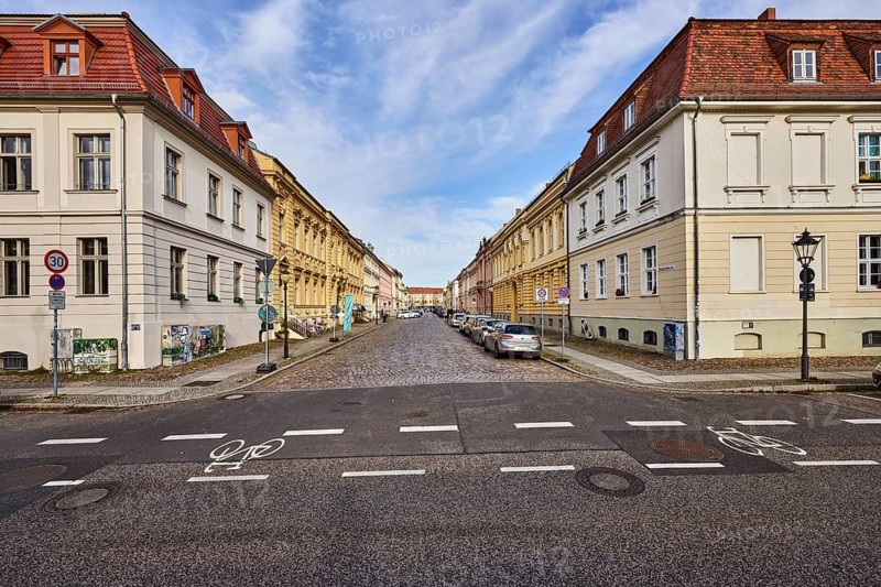 Residential area, historic residential buildings, residential buildings, rental house, lantern, roads, cycle path, asphalt and cobblestone pavement, blue sky, cumulus clouds, cirrostratus clouds, slightly diffused and sunny light, Wilhelm-Staab-Straße junction in Yorckstraße, Potsdam, state capital, district-free city, Brandenburg, Germany