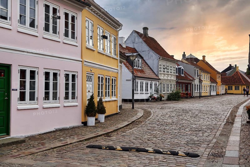Historic residential district in the old town, colorful, traditional half-timbered houses in the evening, cobblestones, H.C. Andersen district, Odense, Funen Island, Denmark