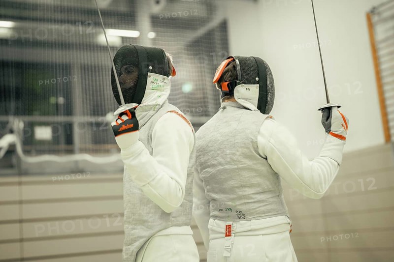 Two fencers standing back to back, each holding a sword, fencing, TSV Calw, Calw district, Germany