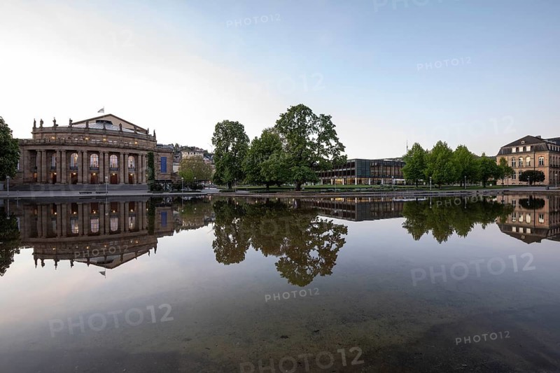 24.4.2026: The illuminated Stuttgart State Opera house and Landtag reflected in the calm Eckensee lake at dawn. Early morning cityscape. Stuttgart, Baden Wuerttemberg, Germany