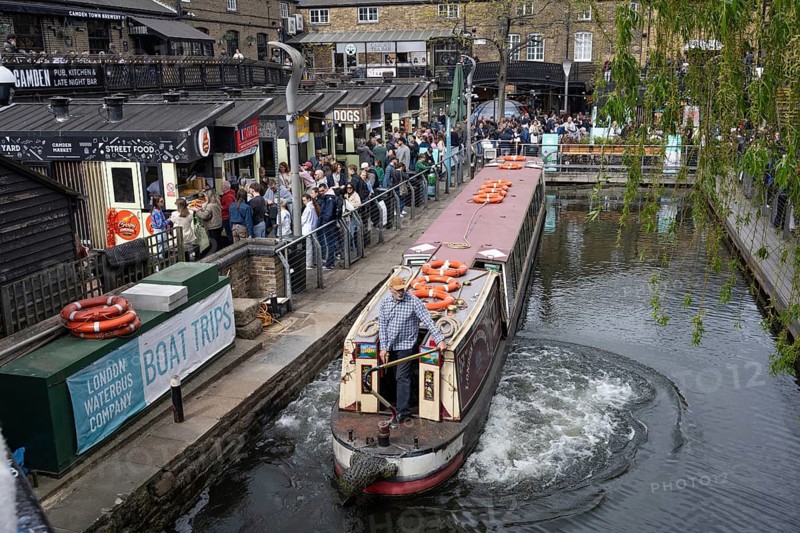 London, United Kingdom. April 17th 2026. A canal tour boat leaves Camden Lock on the Regents Canal, the location of Camden Market, popular with street food stalls, bars, restaurants and music venues, London, UK