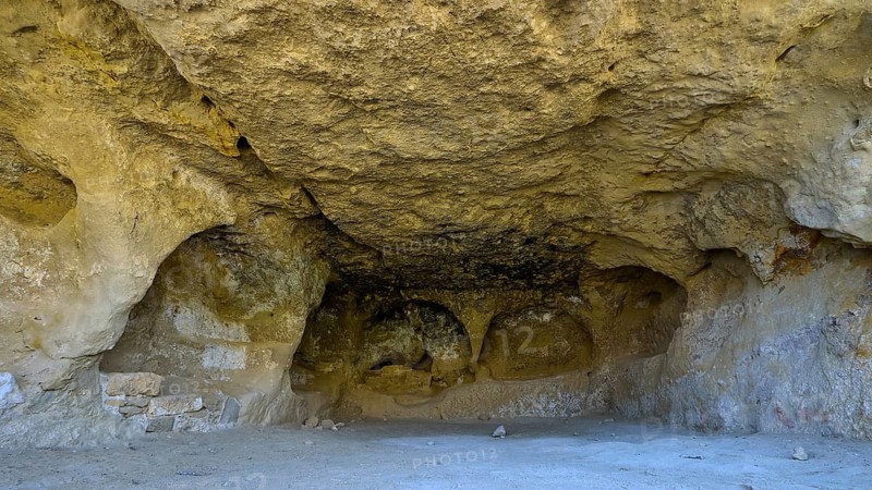 Neolithic caves, former hippie paradise, natural sandstone cave with bright rock walls and peaceful atmosphere, Matala, south coast, Crete, Greek Islands, Greece
