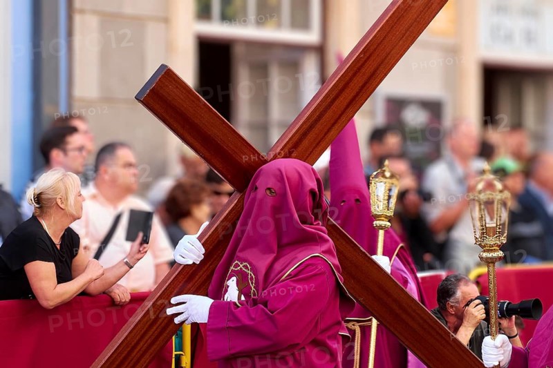 Participants in purple robes carry a large cross in front of spectators, Good Friday procession, Easter, UNESCO World Heritage Site, old town of San Cristobal de La Laguna, La Laguna, Tenerife, Canary Islands, Spain