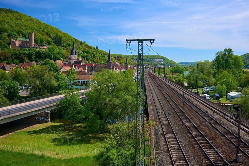 A town with railway lines and power poles, surrounded by green nature and hills, Gemünden am Main, Main-Spessart district, Spessart, Mainfranken, Lower Franconia, Bavaria, Germany